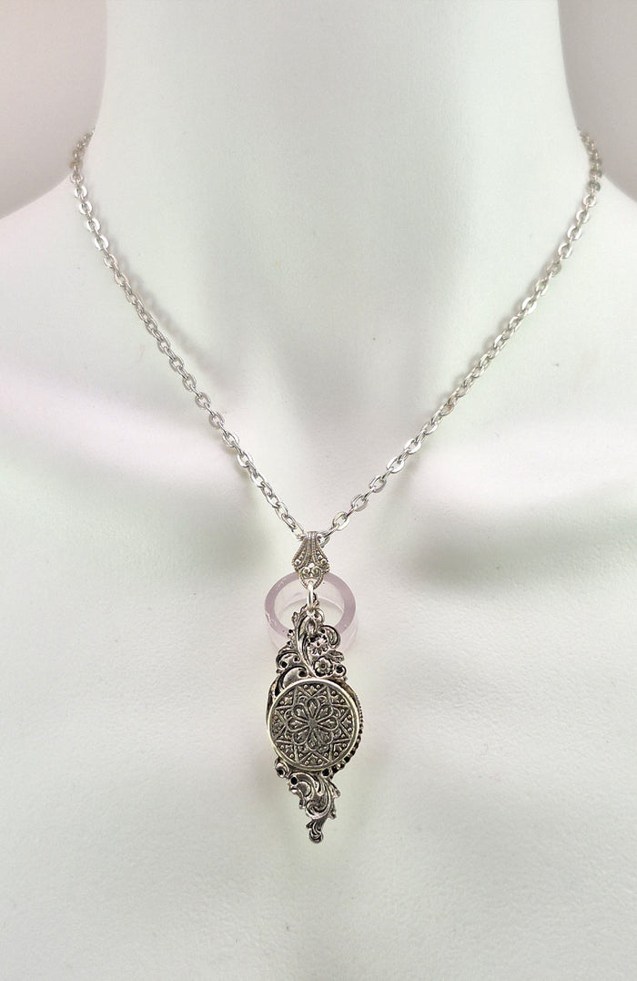 The rear face of the Sterling silver filled Victorian antique or reproduction work from original mold featuring a compass rose design.