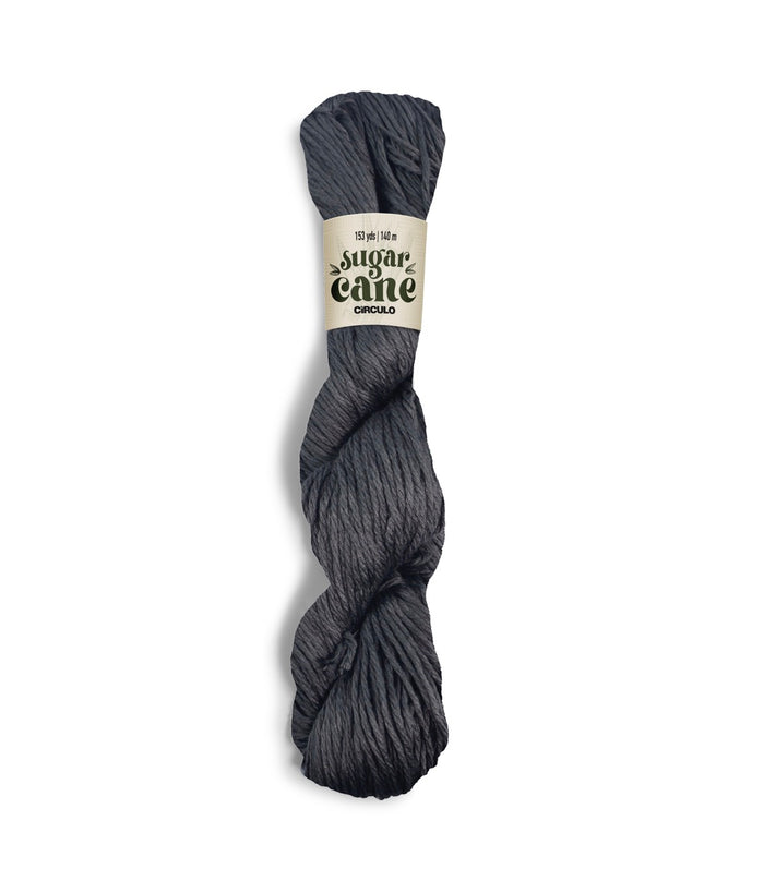 An image of a skein of Circulo DK weight yarn in a charcoal gray color with a ‘Sugar Cane’ label against a white background.