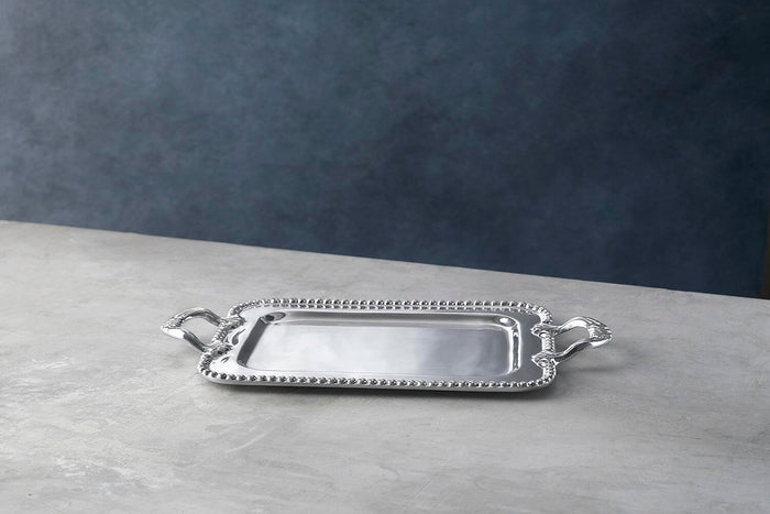 Beatriz Ball Pearl David Small Tray — Low angled view on a gray surface