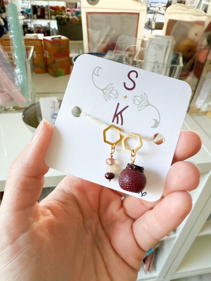 Persephone’s Pomegranate Stitch Markers by Sassafras Knits